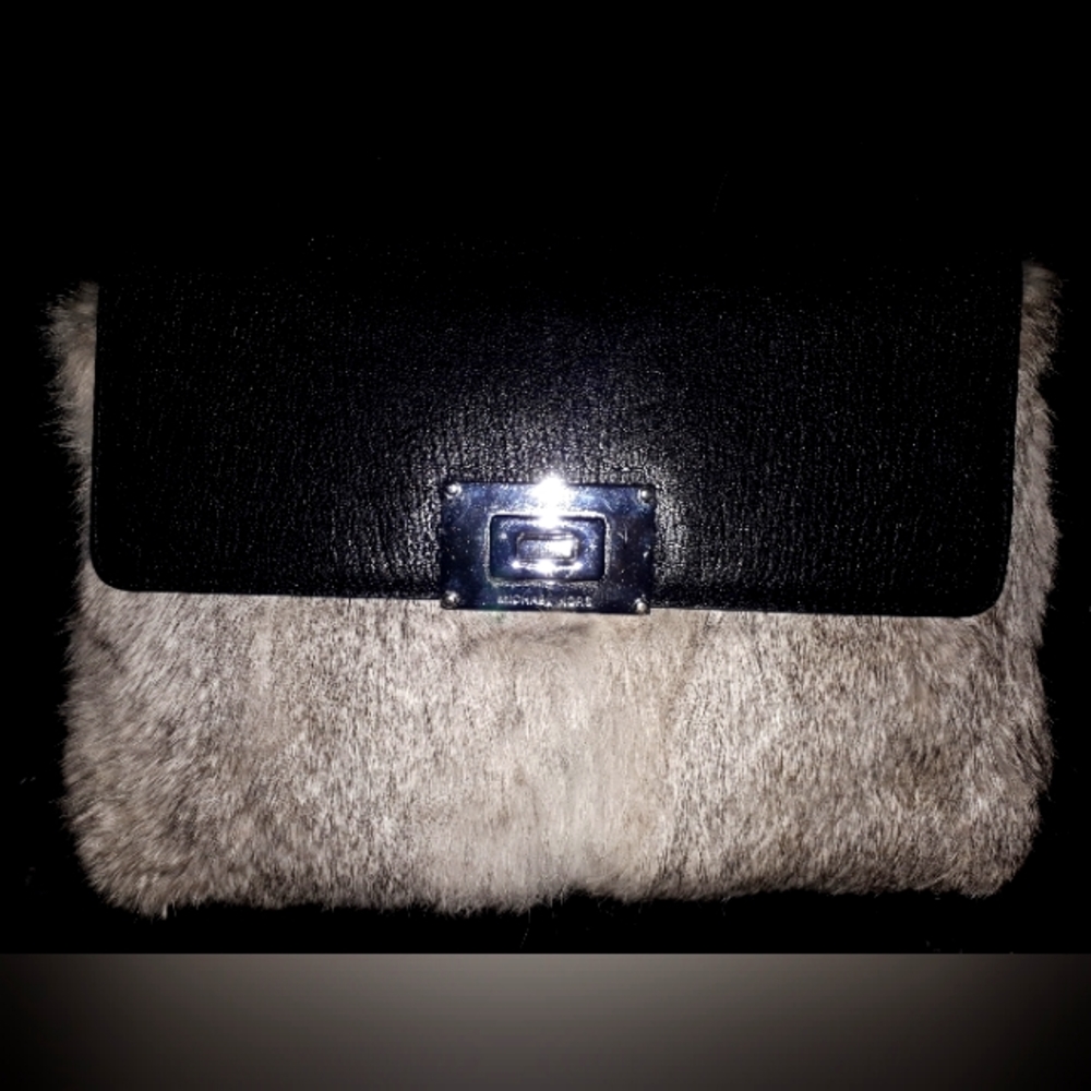 Leather Michael kors purse with fur on the outside flap
